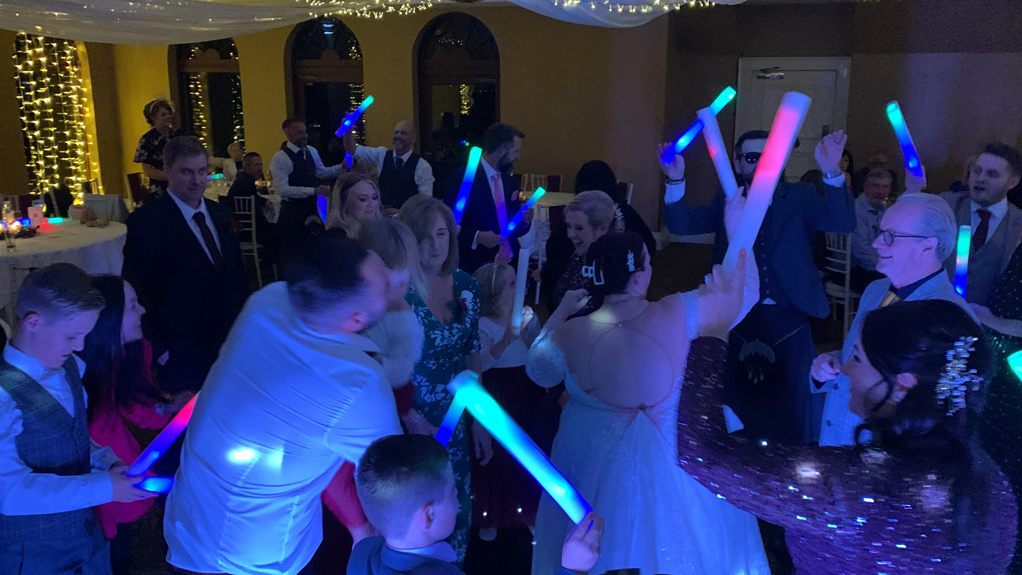 Romantic first dance at a Dumbarton wedding reception with professional DJ lighting